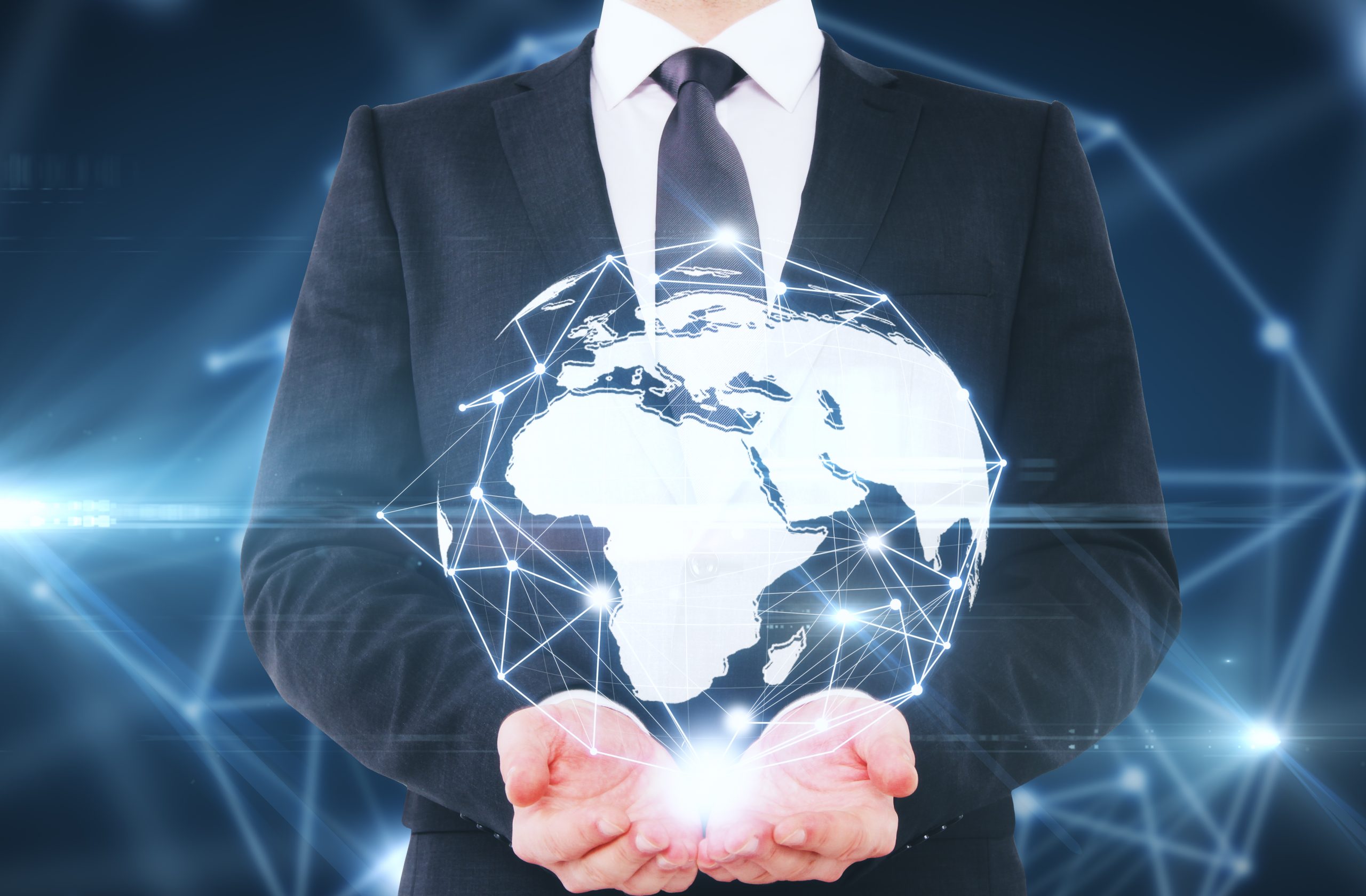 Man holding abstract connected globe on blue background. Global business concept